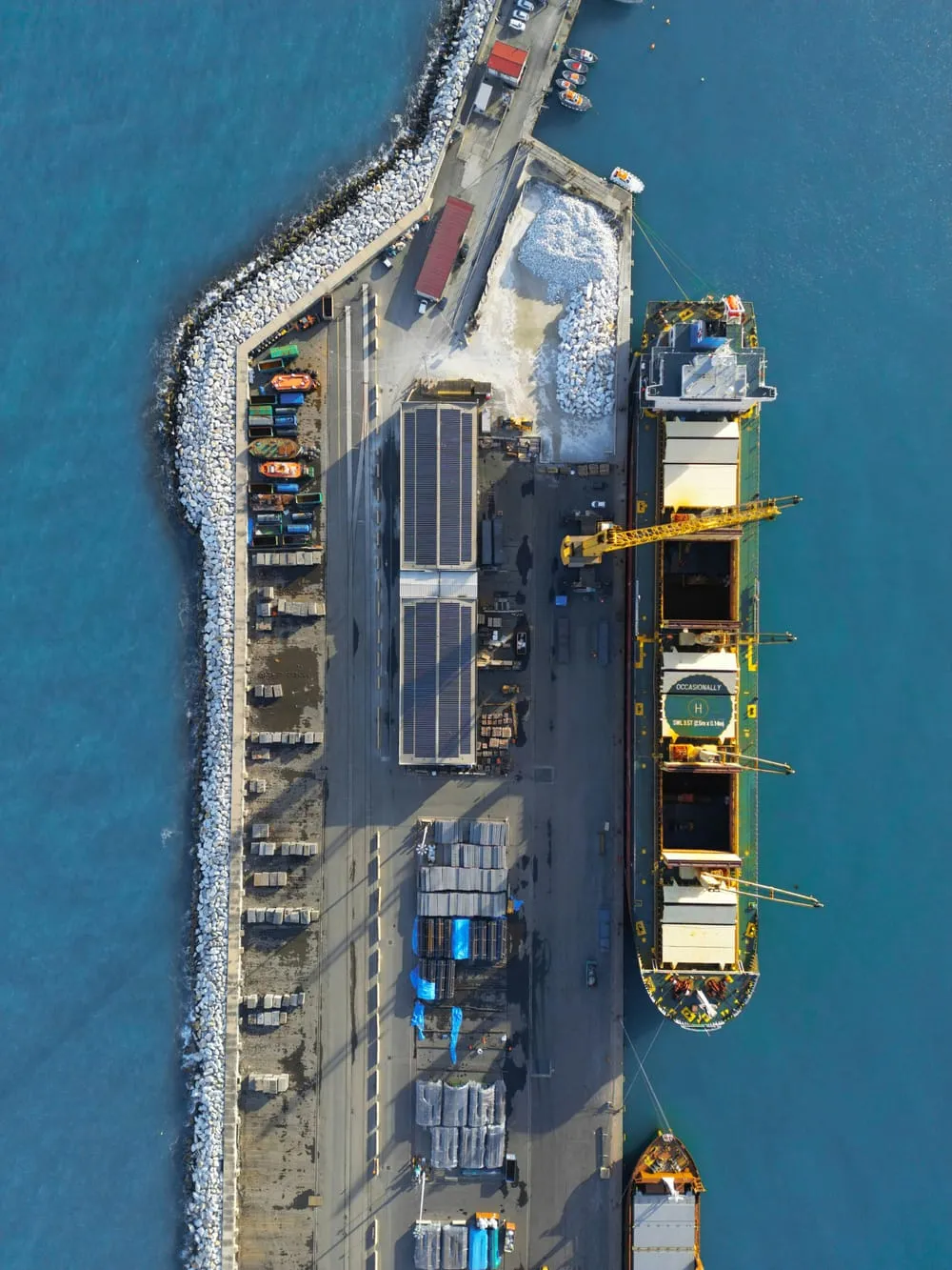 Aerial view of a vessel berthed at a port jetty